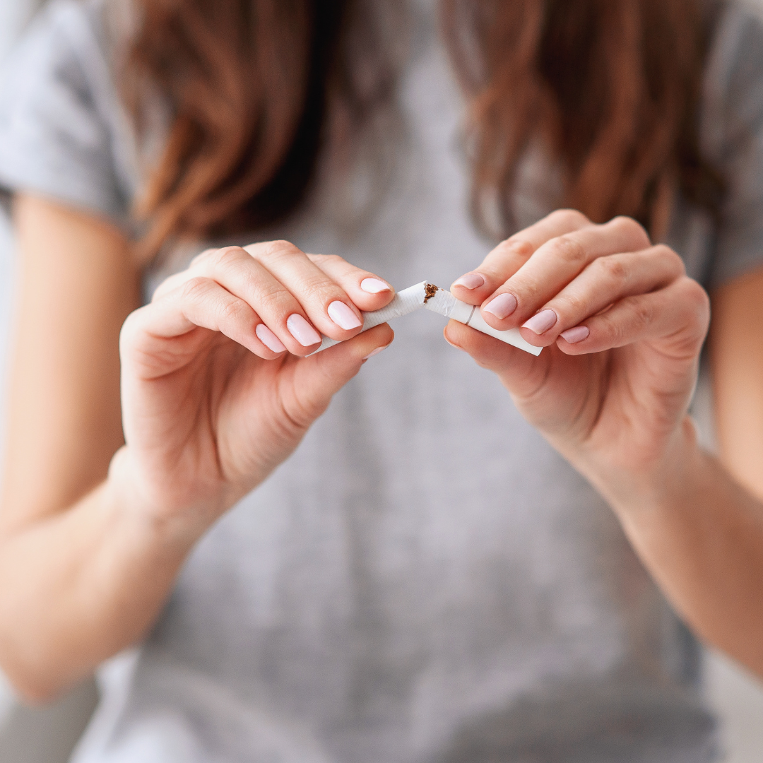 stop smoking hypnosis woman breaking cigarette